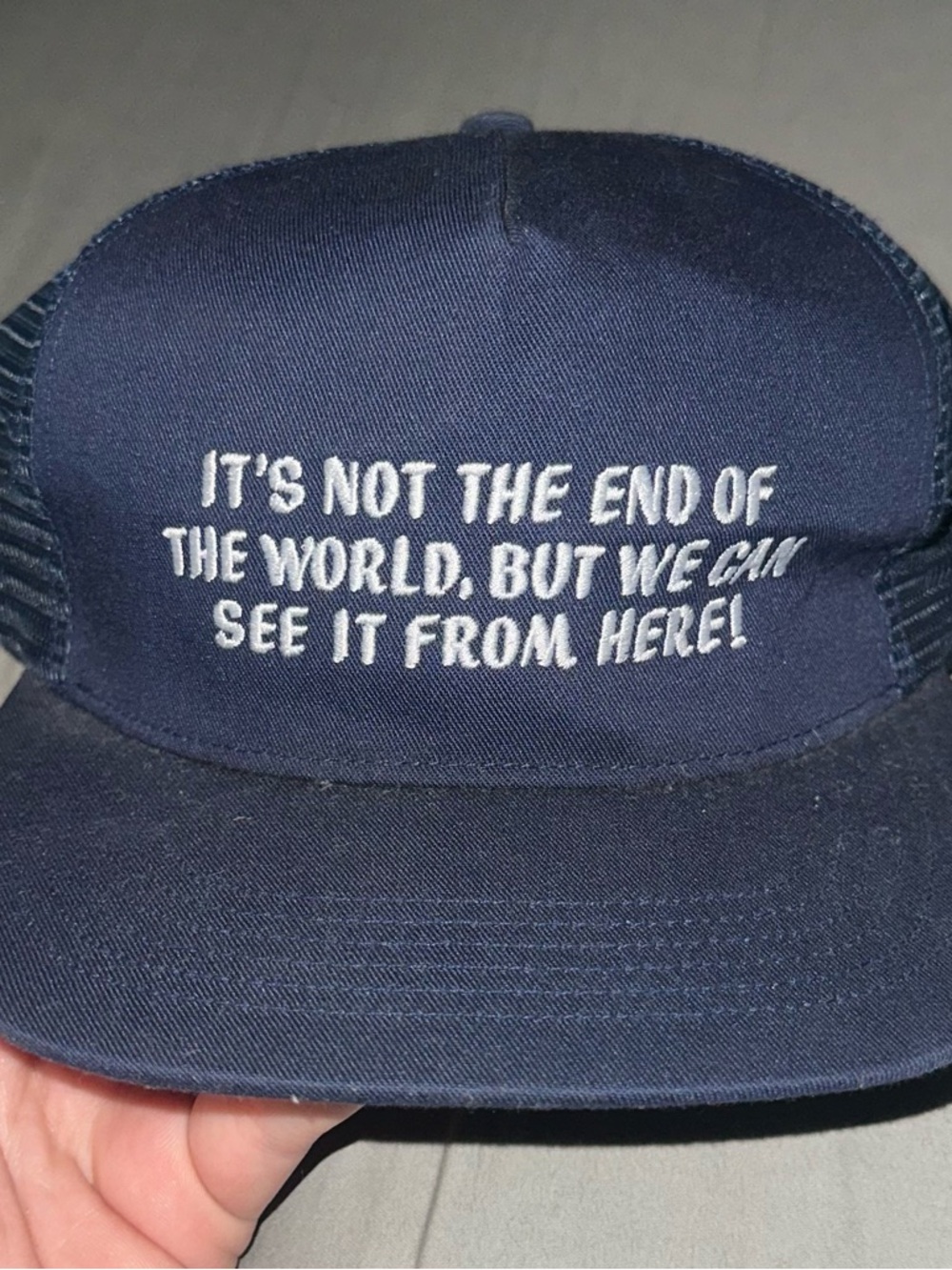 Supreme Navy Blue Trucker Hat with White Embroidered Slogan